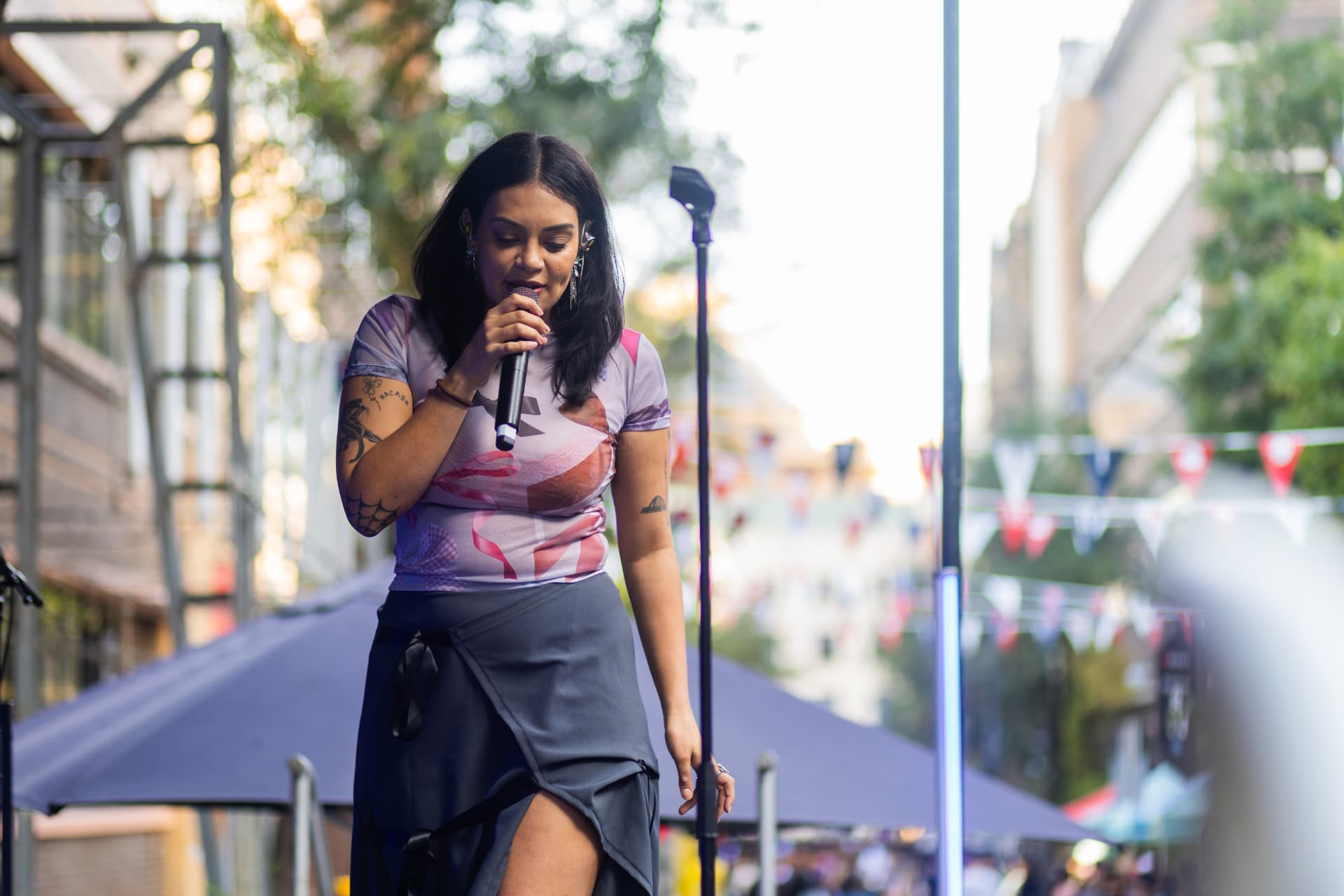 Close-up of a performer singing at an RMIT University event