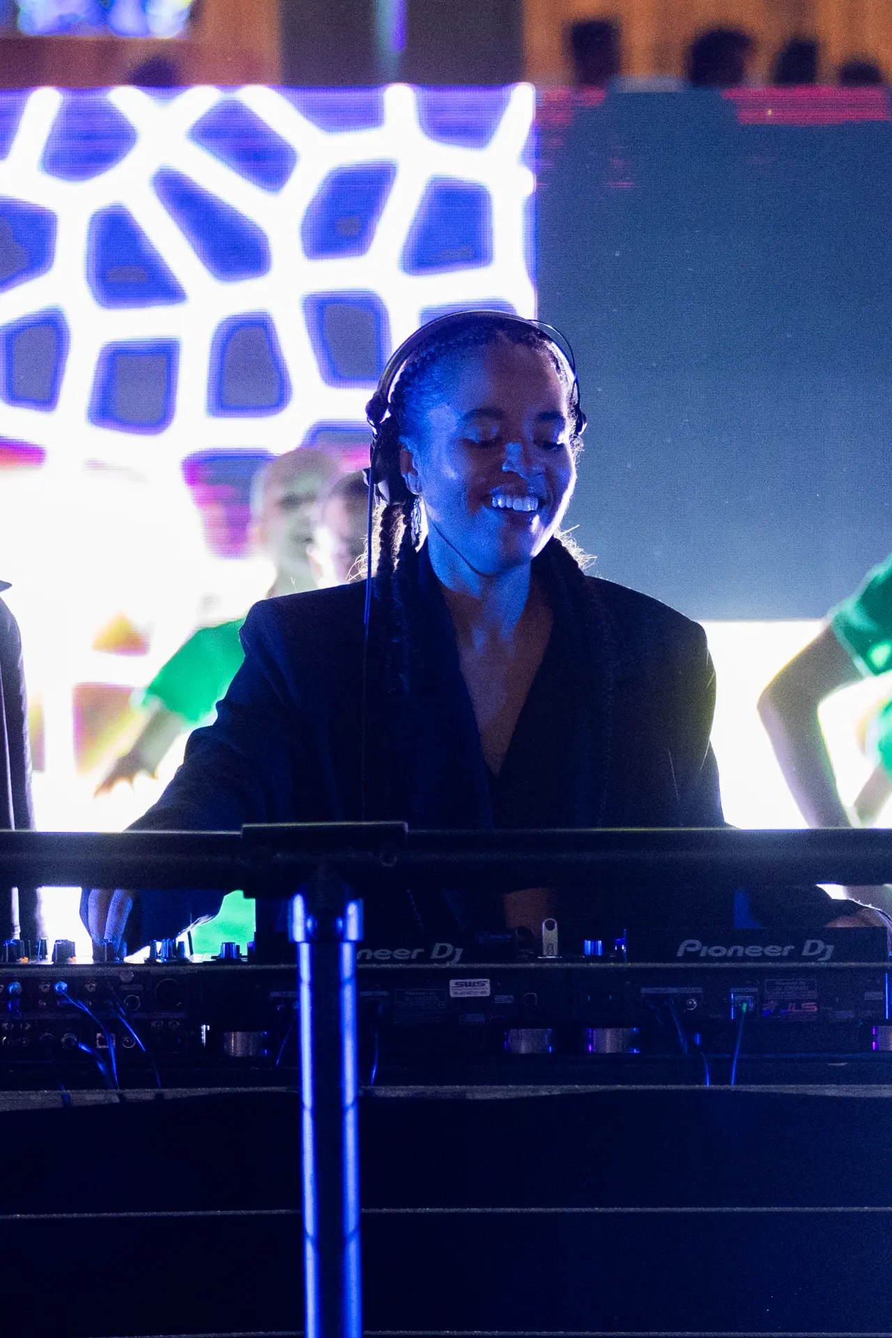 DJ performing under blue stage lights at a WBBL Melbourne event